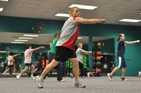 people exercising in a room together